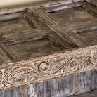 Close up image of a unique Indian furniture teak counter table with vintage shelving and aged green paint, antique console with original wood panel detailing, 152 × 64 × 102 cm.