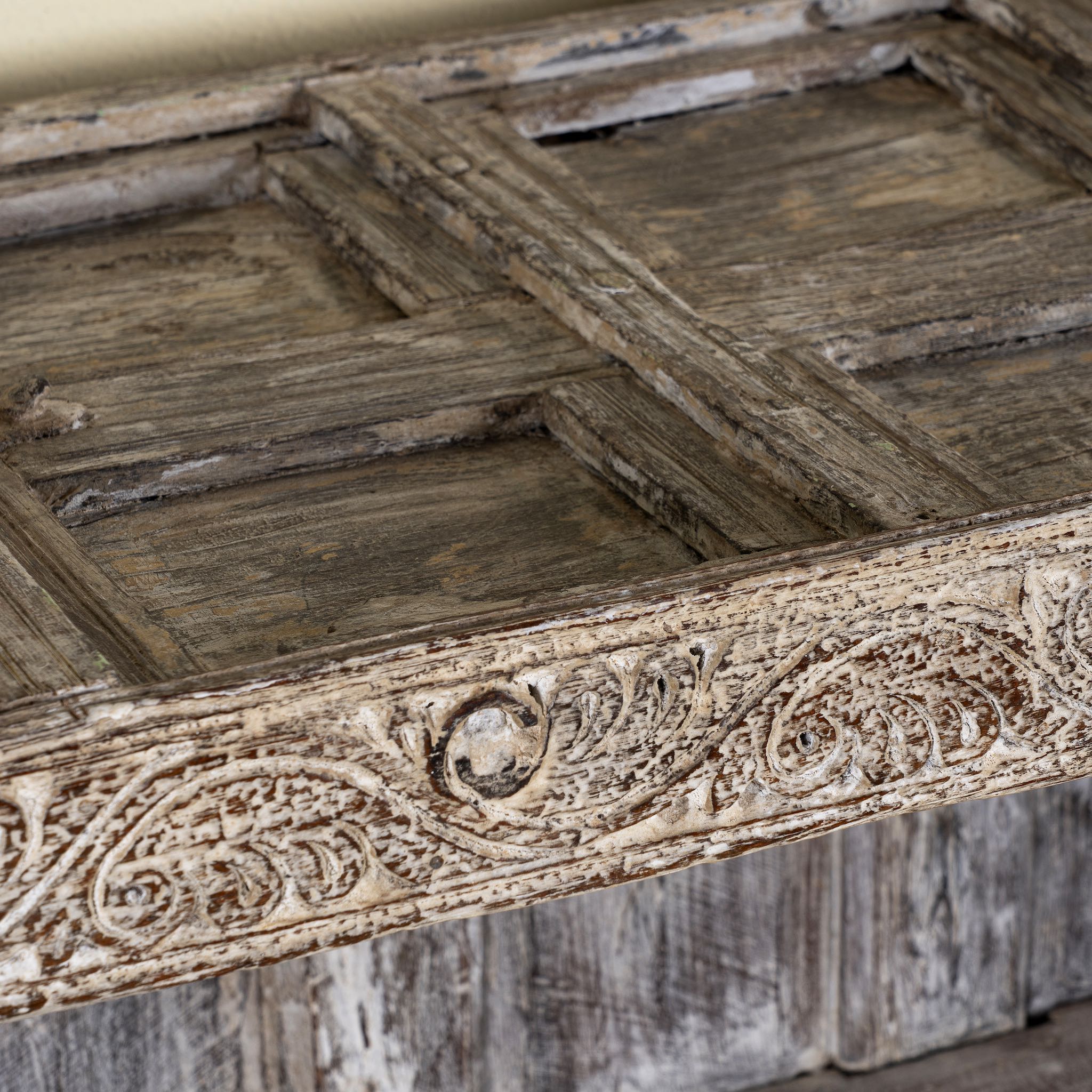 Close up image of a unique Indian furniture teak counter table with vintage shelving and aged green paint, antique console with original wood panel detailing, 152 × 64 × 102 cm.