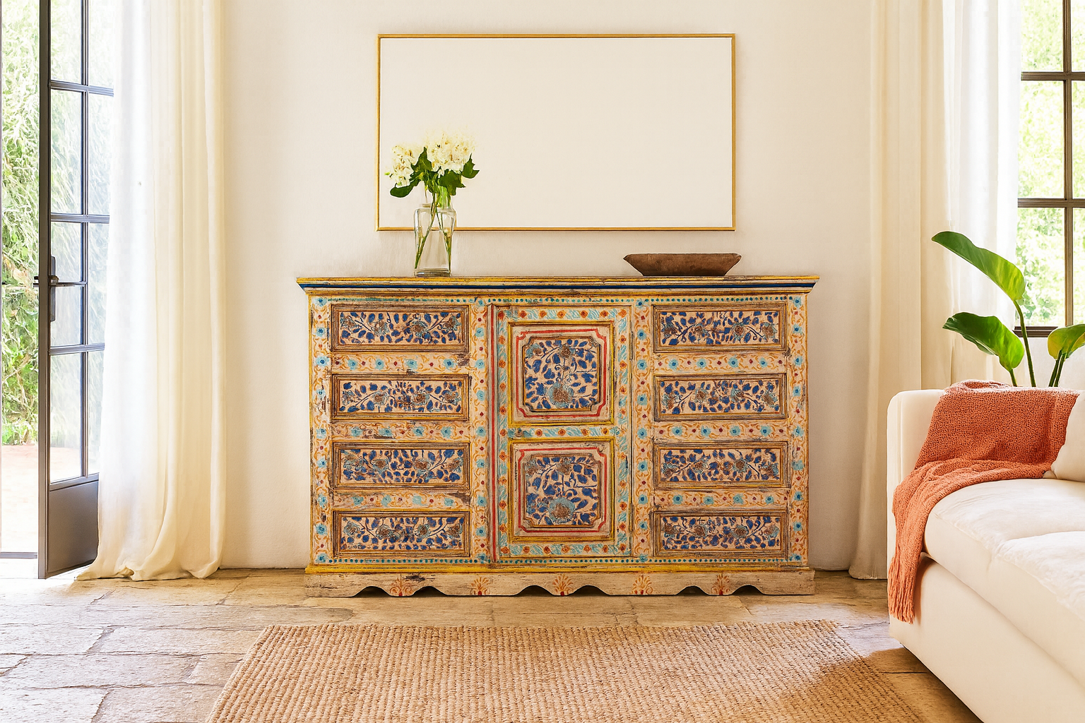 Lifestyle scene of a hand-painted reclaimed wood sideboard with floral motifs – a unique piece of sustainable furniture for vibrant Indian home decor.