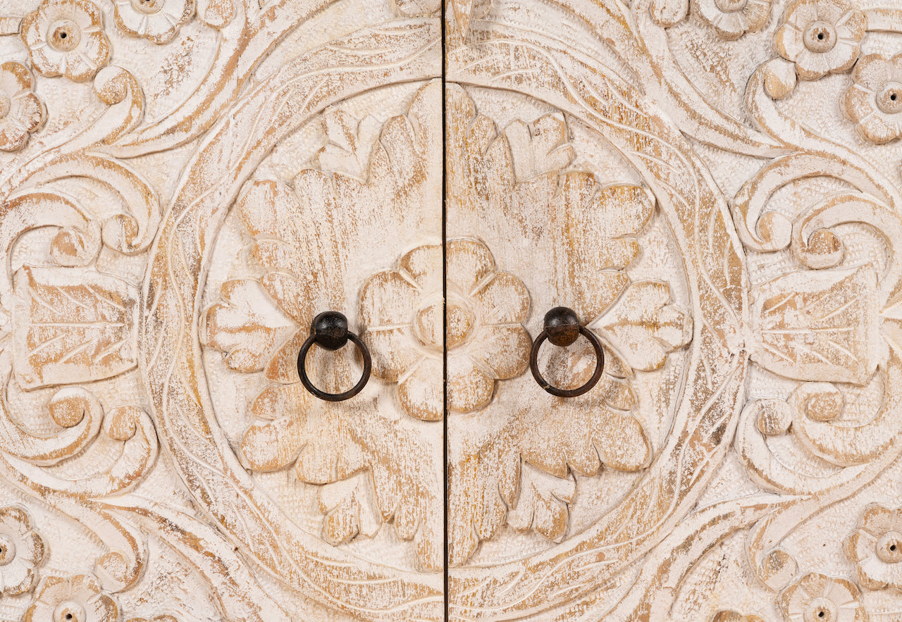 Close up image of a hand-carved traditional sideboard made from mango wood with whitewashed floral detailing; perfect as entryway table vintage or TV unit, 198 × 82 × 40 cm.