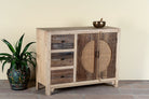 Side angle image of a reclaimed wood sideboard Amruta with three drawers and rattan-inlay cabinet doors in a circular design. A piece of sustainable furniture blending rustic wood textures and handcrafted detail.