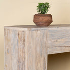 Close up image of a minimalist reclaimed wood console in Ibiza style with light sun-washed finish, 250cm length.