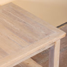 Close up image of a Anil bleached reclaimed wood coffee table with rectangular top and full-width lower storage shelf, 120x60x50cm
