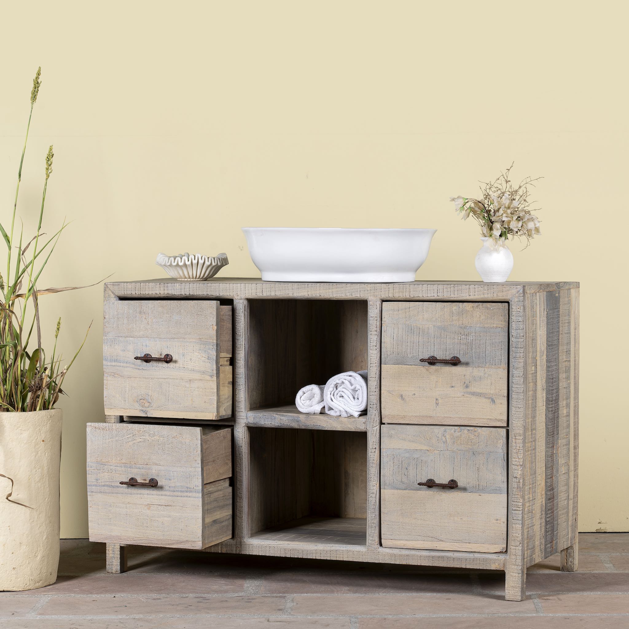 Image with open drawers of a reclaimed wood console with 6 drawers and 2 open shelves; Ibiza style bathroom console with matching Bhavya mirror available, 120 × 50 × 80 cm.