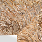 Close up image of a carved mango wood mirror Anumati with floral motifs and distressed finish. A handcrafted Indian furniture piece perfect for vintage home decor and artisanal interiors.