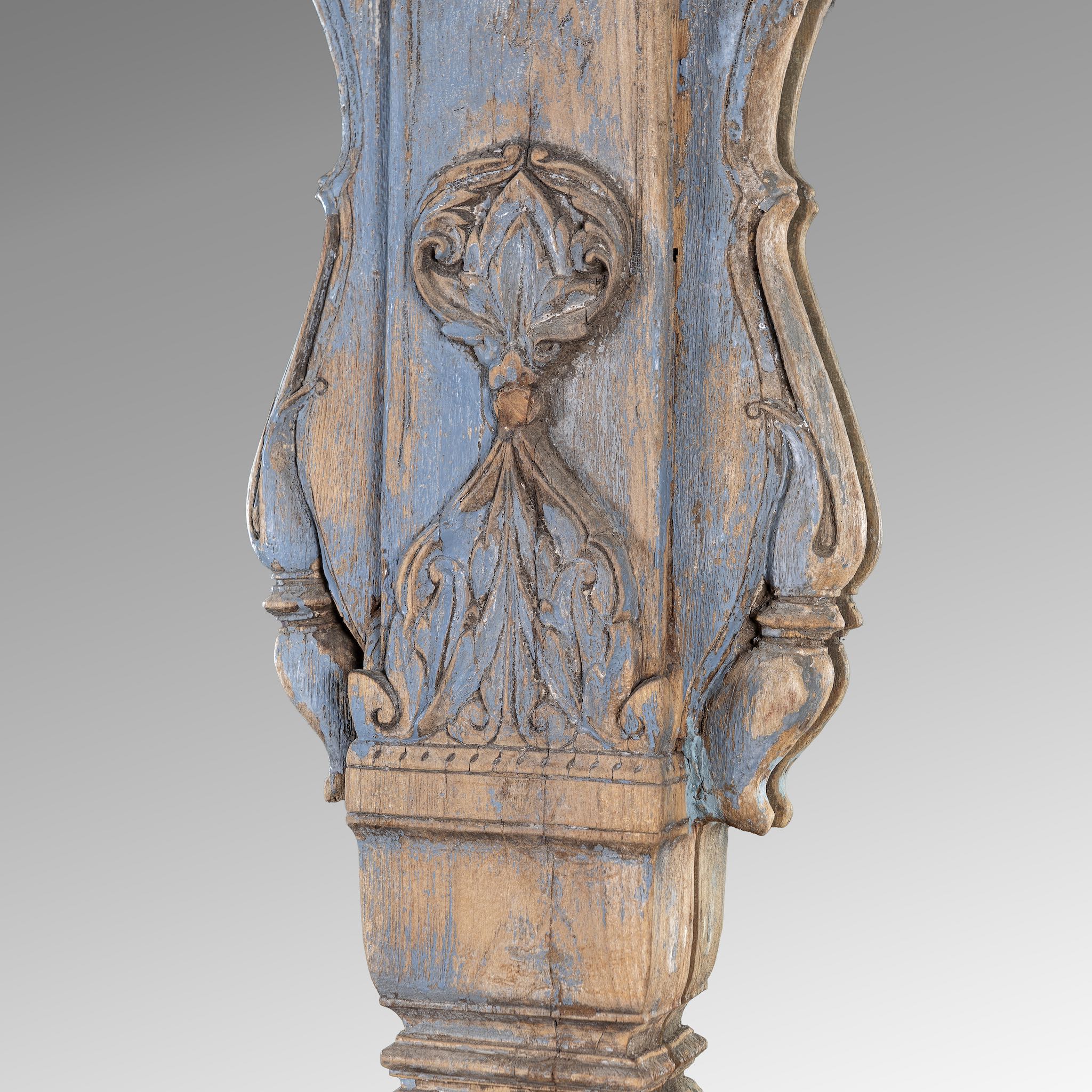 Close up image of a antique arch mirror Anuradha made from a reclaimed teak triple window frame with indigo patina and carved columns. A large, unique Indian furniture piece for vintage and bohemian interiors.