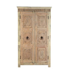 White background image of a reclaimed teak wood cabinet Anwika featuring a tall Mediterranean-style frame with hand-carved antique Indian doors. A unique piece of Indian furniture offering character-rich storage and timeless design.