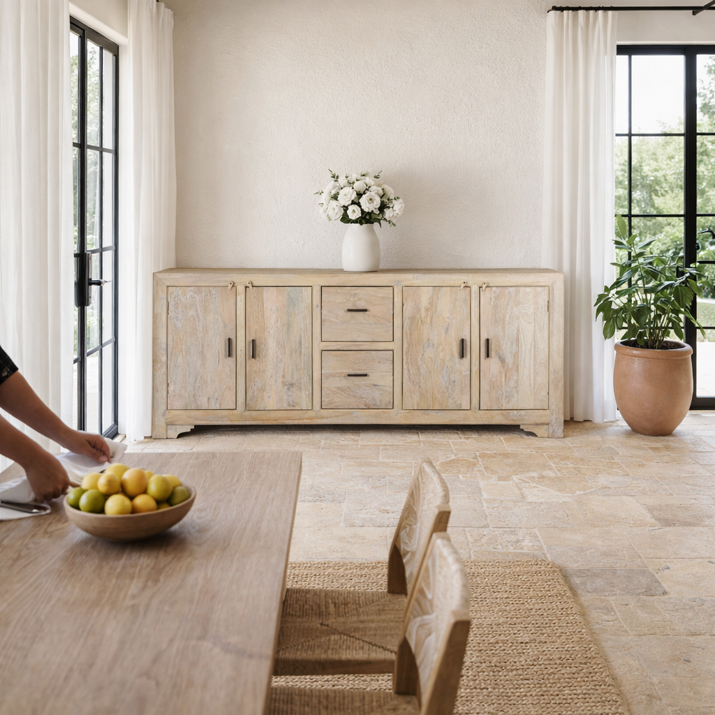 Lifestyle image of a sandblasted wood sideboard with 2 drawers and 4 cabinets, living room furniture in relaxed Ibiza style.