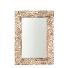 White background image of a carved mango wood mirror Apasmara in white-washed finish with hand-carved floral details. A handcrafted Indian furniture piece ideal for vintage home decor and boho interiors.