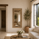 Lifestyle image of a reclaimed wood mirror Aranyani with sanded beach wood texture and minimalist design. A Japandi style mirror handcrafted in Rajasthan, offering rustic charm and sustainable elegance.