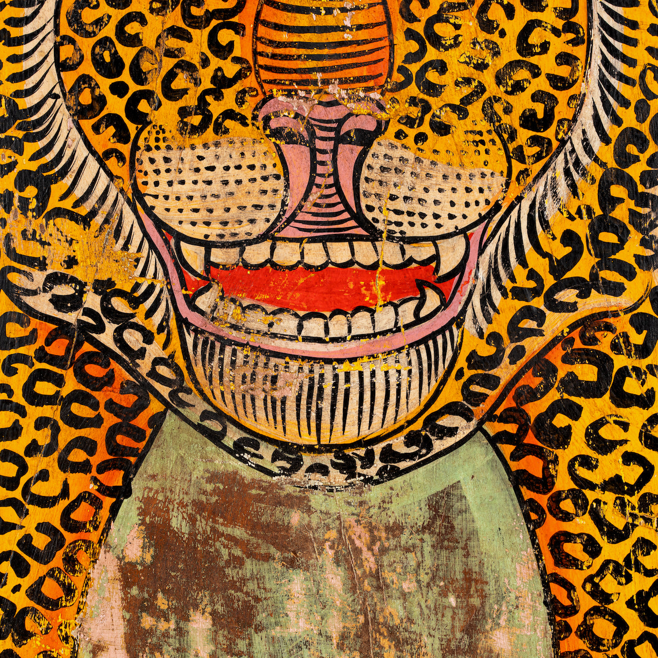 Close up image of a Ardra hand-painted wooden wall decoration featuring a vibrant Indian tiger motif on recycled teak—an eye-catching Indian door decoration full of artistic detail and heritage.