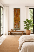 Lifestyle image of a Ardra hand-painted wooden wall decoration featuring a vibrant Indian tiger motif on recycled teak—an eye-catching Indian door decoration full of artistic detail and heritage.