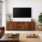 Lifestyle imagination with a reclaimed wood low board Ariana in rustic minimalistic style with four cabinets and two drawers. A sustainable furniture piece offering functional storage and natural texture for modern living spaces.