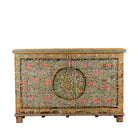 White background image of a Armaan hand painted reclaimed teak wood storage chest with colourful floral motifs and traditional iron fittings, 151cm wide