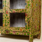 Close up picture  of a hand-painted reclaimed wood showcase cabinet with floral motifs and glass doors, sustainable furniture and vintage home decor style, 96 × 40 × 182 cm.