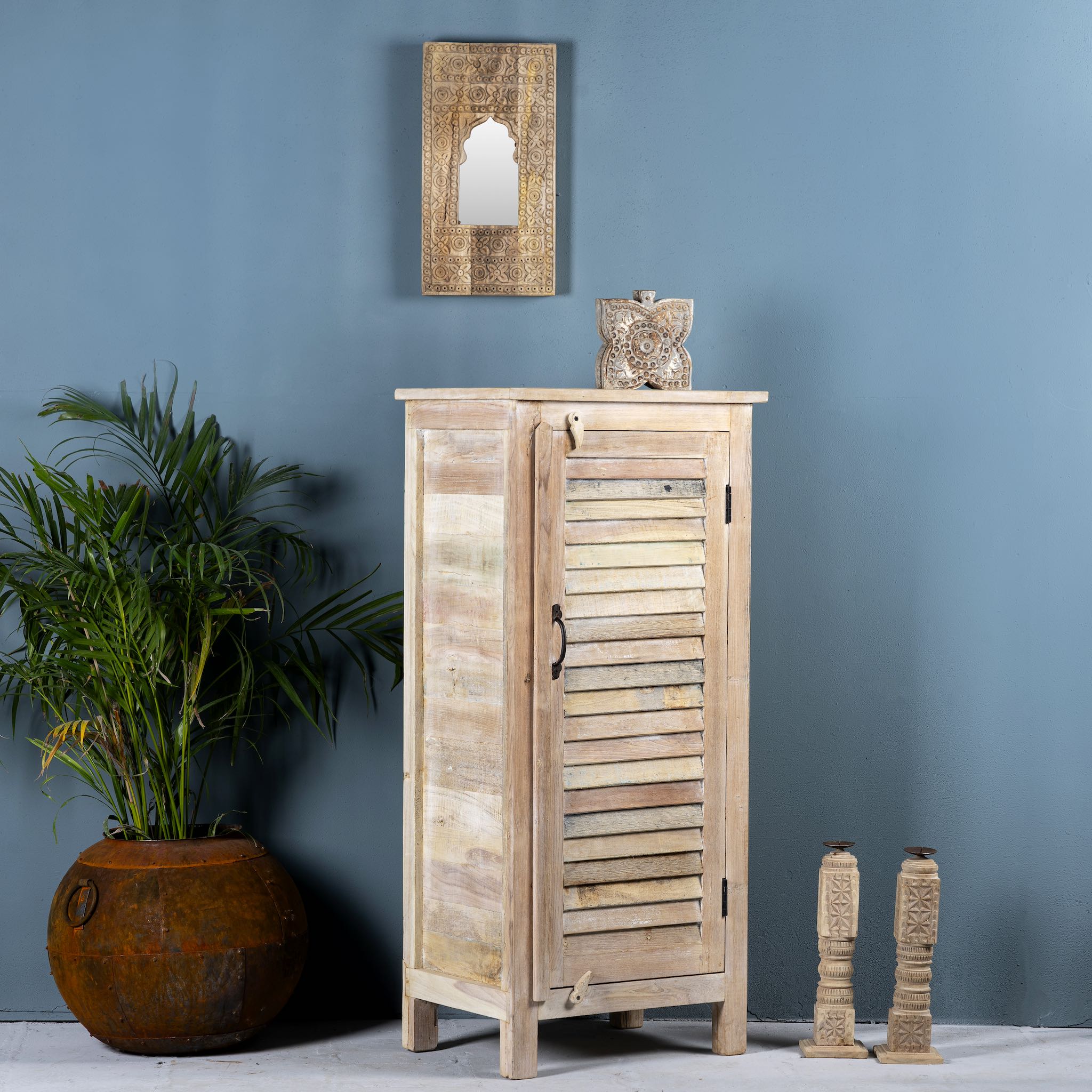Side angle image of a reclaimed teak wood cabinet with slatted door and sandblasted finish, Ibiza-style, 122 × 56 × 40 cm.
