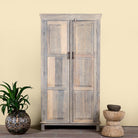 Reclaimed wood wardrobe with panelled double doors and rustic finish; bathroom furniture with ample storage, 100 × 45 × 190 cm.