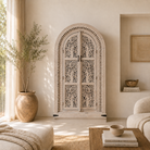 Lifestyle imagination of a arched wooden wardrobe with Tree of Life carving, mango wood, sandblasted finish; unique storage cabinet 100 × 42 × 190 cm.
