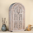 Side angle image of Artha cabinet with Tree of Life carving, a unique furniture piece from our mango wood furniture collection.