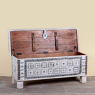 Image showing open lid of a Aryav whitewashed mango wood coffee table chest with decorative iron fittings 116cm