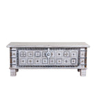 White background image of a Aryav whitewashed mango wood coffee table chest with decorative iron fittings 116cm