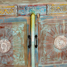 Close up image of a Aryen hand carved reclaimed wood sideboard with vintage house elements and distressed blue turquoise finish 120cm