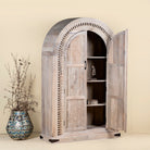 
Side angle with open door of Ashwin wardrobe with arched carved doors, a unique furniture design from our mango wood furniture collection.