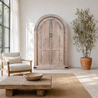 Hand-carved wooden wardrobe with arched silhouette and floral detailing – Ashwin by Om Home & Garden, artisanal mango wood furniture with vintage character.