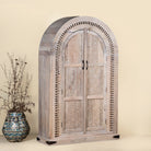 Side angle image of Ashwin wardrobe with arched carved doors, a unique furniture design from our mango wood furniture collection.