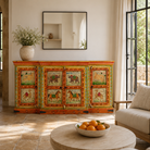 Lifestyle image of a hand-painted reclaimed wood sideboard with Indian god motifs; unique hand painted furniture and Indian furniture online, 177 × 92 × 51 cm.
