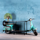 Side Image of a house bar crafted from a full vintage Indian Bajaj scooter with industrial metal frame and wooden shelves, featuring original patina and retro design elements."

