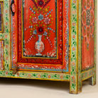 Close up image of a sustainable hand painted sideboard made from reclaimed teak wood with floral motifs; bold bohemian furniture, 150 × 45 × 90 cm.