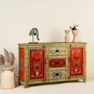 Side angle image of a sustainable hand painted sideboard made from reclaimed teak wood with floral motifs; bold bohemian furniture, 150 × 45 × 90 cm.