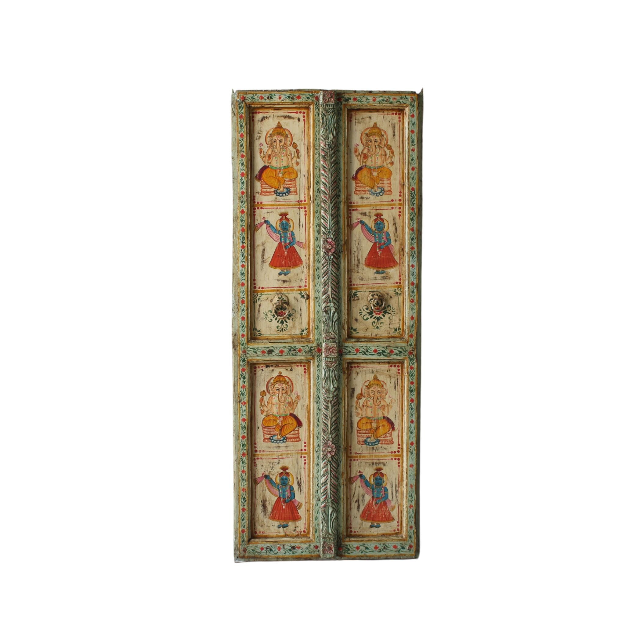 White background image of a Aum hand-painted teak door panel featuring Goddess Lakshmi and traditional dancers, framed by leafy green carvings—a spiritual and unique Indian wall decoration repurposed from antique teak architecture.
