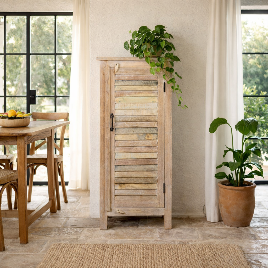 Lifestyle image of a reclaimed teak wood cabinet with slatted door and sandblasted finish, Ibiza-style, 122 × 56 × 40 cm.