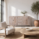 Lifestyle image of a sandblasted wood sideboard with drawers and cabinets, living room furniture in relaxed Ibiza style.