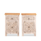 White background image of a pair of vintage night stands in mango wood with hand-carved geometric details and distressed finish; ideal for vintage home decor, 76 × 56 × 35 cm.