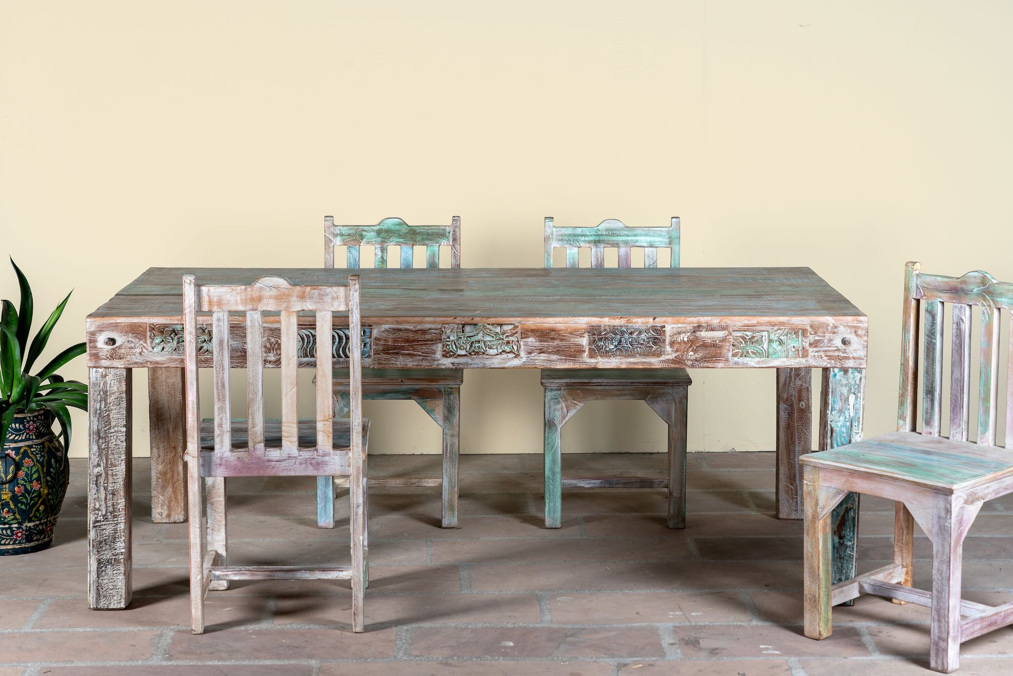 Reclaimed wood dining set Ayla with one vintage table and six rustic chairs. A handcrafted bohemian interior piece combining sustainable materials with artistic, timeworn charm.