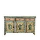 White background image of a hand-painted sideboard made from reclaimed wood, featuring three drawers and three cabinet doors adorned with intricate floral borders and tree motifs in earthy green and warm tones, finished in a soft distressed patina for a vintage artisanal look.
