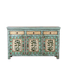 White background image of a hand-painted sideboard made from reclaimed wood, featuring three drawers and three cabinet doors adorned with intricate floral borders and tree motifs in earthy green and warm tones, finished in a soft distressed patina for a vintage artisanal look.
