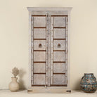 Old door cabinet with reclaimed teak doors, floral carvings, and iron accents; artisan teak wood wardrobe with mango wood frame, 100 × 44 × 206 cm.