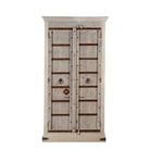 White background image of a old door cabinet with reclaimed teak doors, floral carvings, and iron accents; artisan teak wood wardrobe with mango wood frame, 100 × 44 × 206 cm.