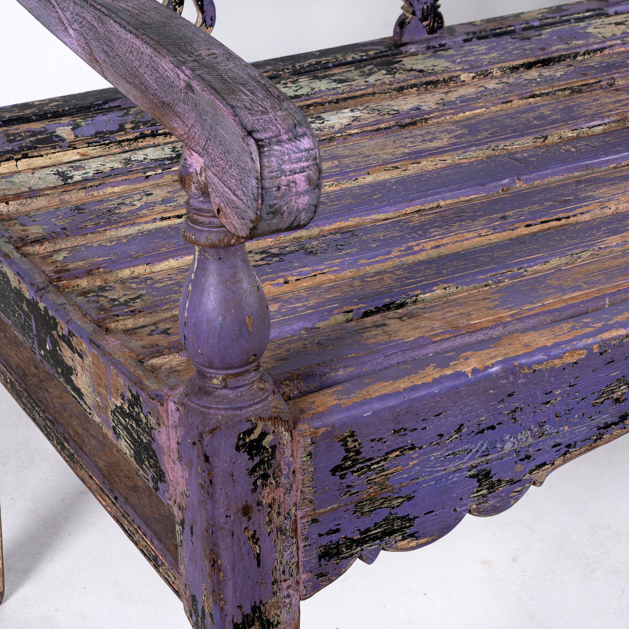 Close up image of a Bagnan reclaimed teak wood bench with distressed shabby chic finish and spindle backrest, 180cm