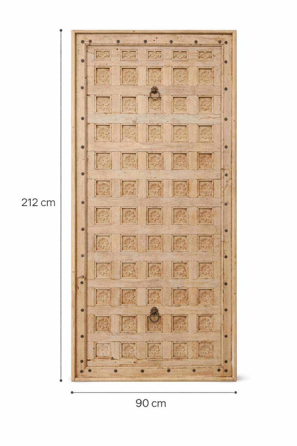 White background image of a Bansuri hand-carved teak headboard made from an old Indian ceiling door, featuring grid-style floral carvings and a distressed whitewashed finish—an eye-catching piece of old door headboards and old Indian door furniture.