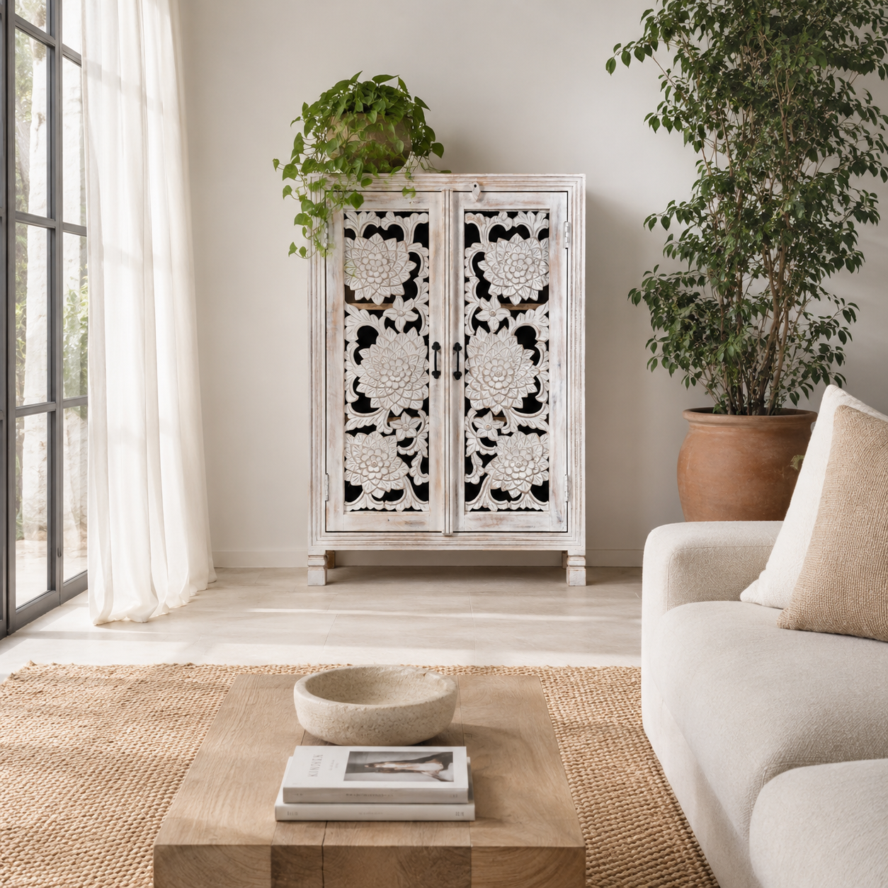 Lifestyle image of a white washed mango wood cabinet with three compartments and hand‑carved floral doors, vintage style, 75 × 40 × 120 cm.