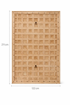 White background image of a Bheem hand-carved teak headboard made from an old Indian ceiling door, featuring floral panel carvings and a whitewashed finish—an authentic piece of old door headboards and old Indian door furniture.