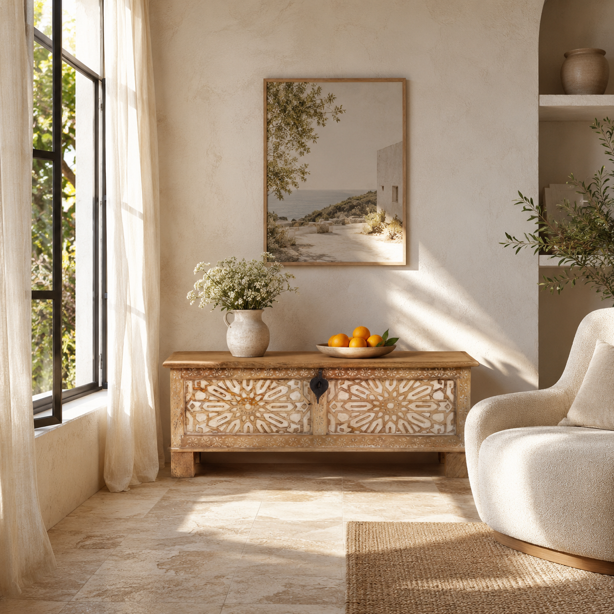 Lifestyle image of a hand-carved mango wood vintage chest with floral carvings – Mediterranean-style storage chest for living rooms, bedrooms, or bathrooms.