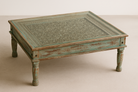 Hand carved mango wood coffee table with floral pattern and multi-layer finish; vintage-inspired coffee table, 120 × 90 × 45 cm.