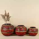 Set of 3 round hand-painted iron pots with silver floral designs on blue background, artisanal Indian home accessories and vintage decor accents.