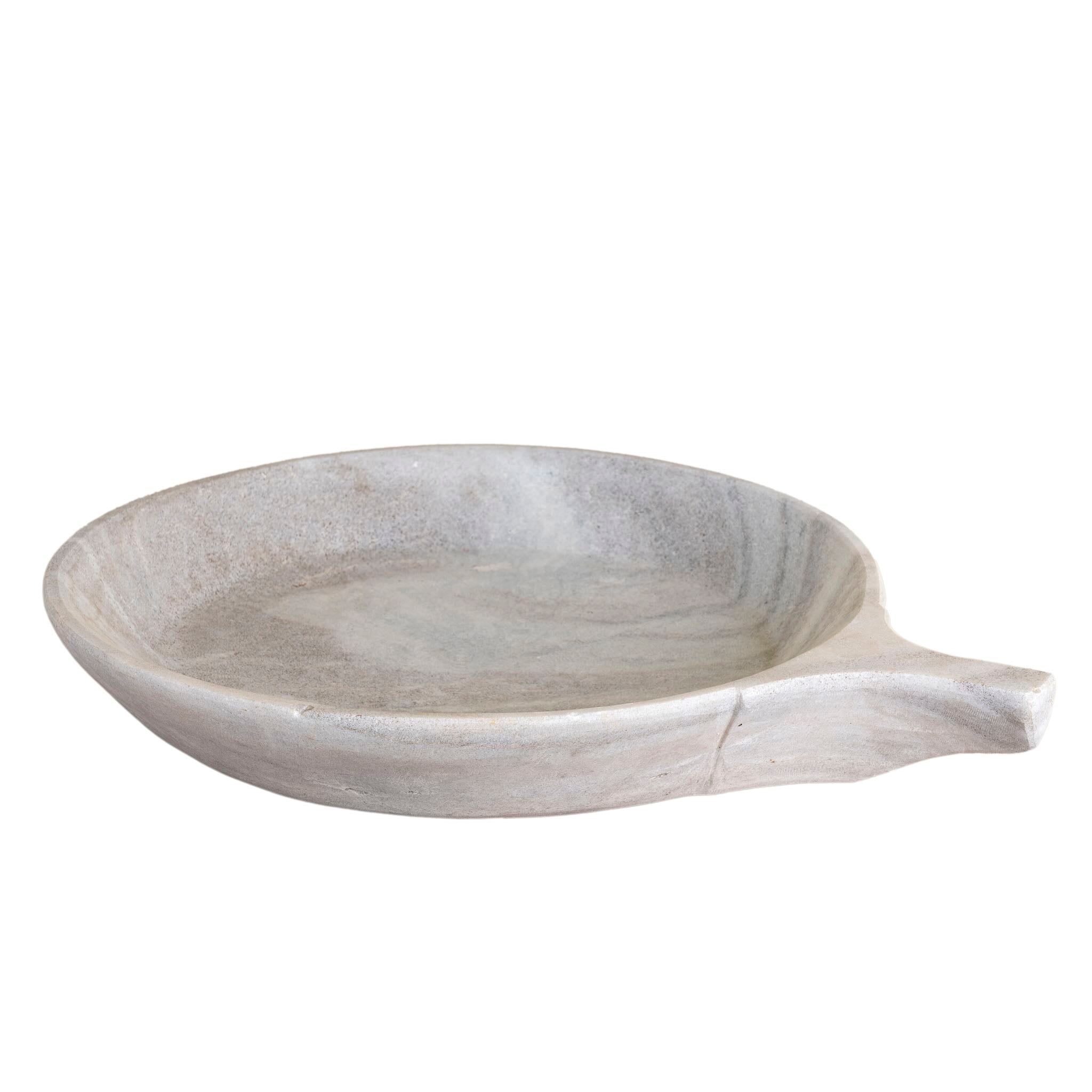 White background image of a hand-carved white marble plate Brij with shallow round form and side handle. A vintage home accessory and unique Indian decoration, ideal as a fruit plate or for bathroom storage in vintage home decor settings.